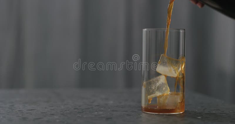 Pour Coffee Over Ice Cubes In Glass To Make Iced Coffee On