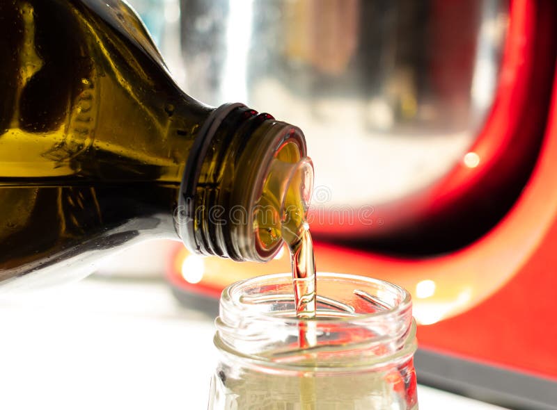 Pour a Drizzle of Oil into a Glass Jar Stock Image Image of homemade