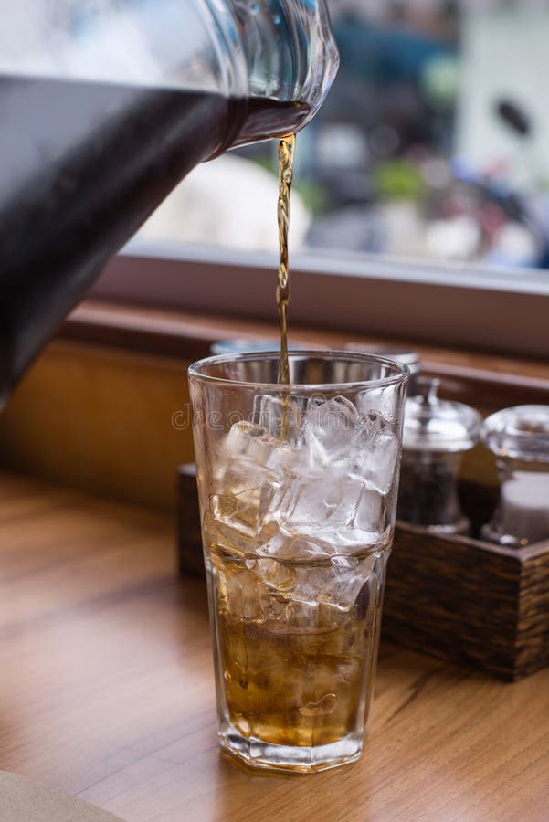 Pour ice coke into ice stock image. Image of liquid 101477461