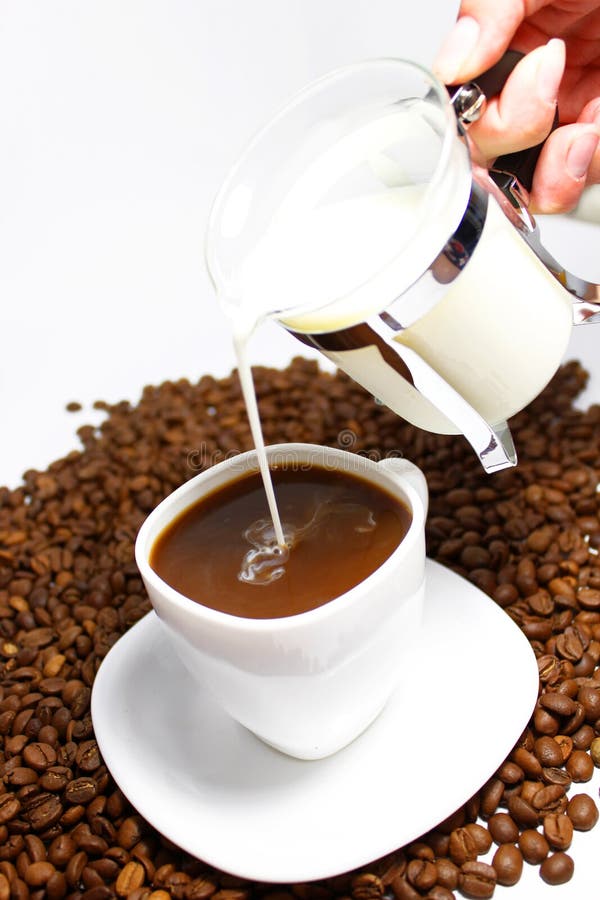 Pour milk in coffee stock image. Image of pour, hand 16296933