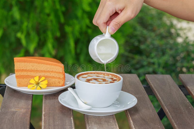 Pour Syrup in a Cup of Coffee. Stock Image Image of saucer, caffeine
