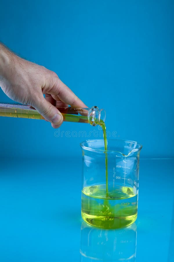 Pouring into a beaker stock image. Image of blue, cylinder 46895531