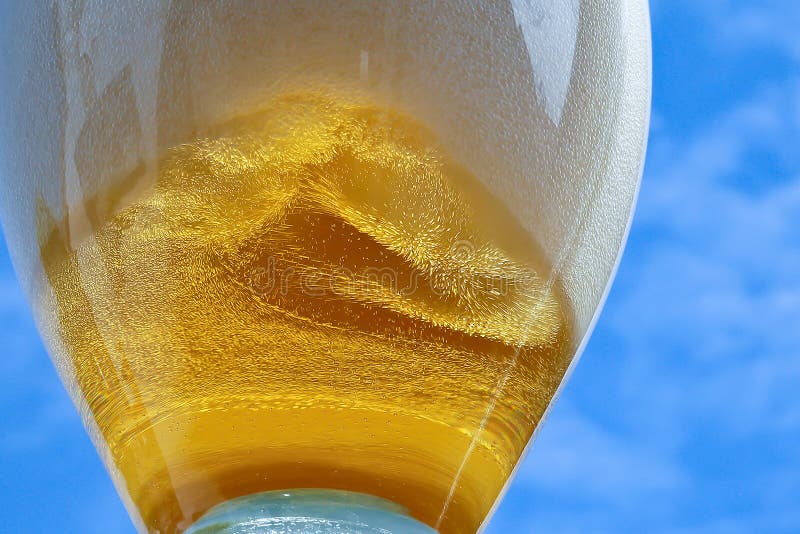 Pouring Beer into the Glass of Beer. Stock Photo Image of closeup