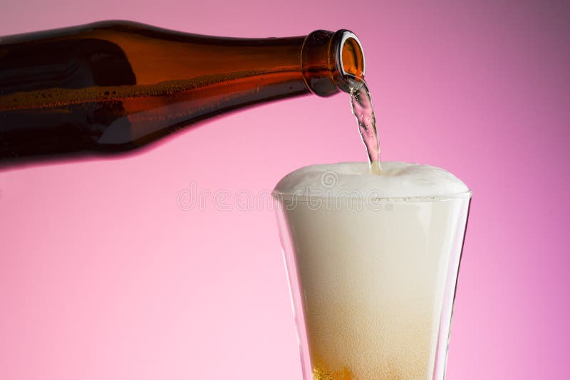 Pouring Beer Into Glass stock photo