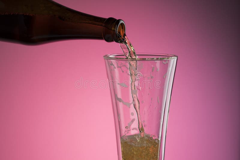 Pouring Beer Into Glass royalty free stock photography