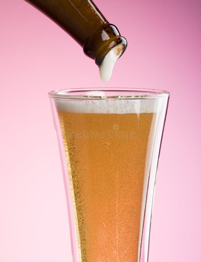 Pouring Beer Into Glass stock photos