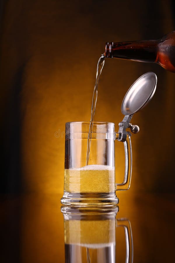 Pouring beer stock photo. Image of dark, flow, froth 42409886