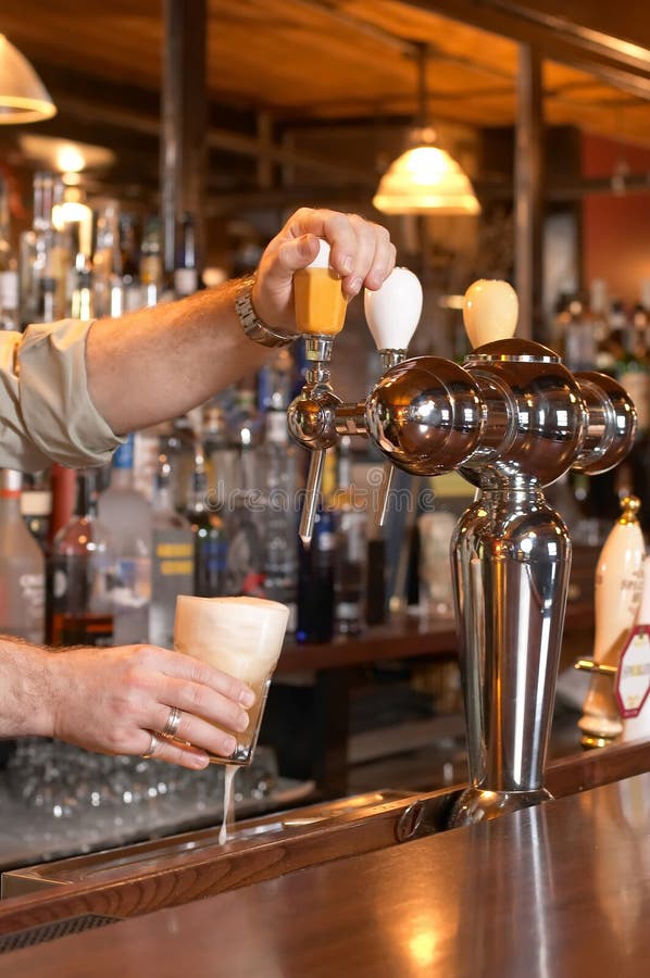Pouring Beer from Tap stock image. Image of fresh, hands 4644719