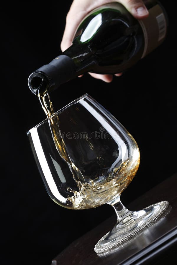Pouring brandy royalty free stock image Pouring brandy royalty free stock image