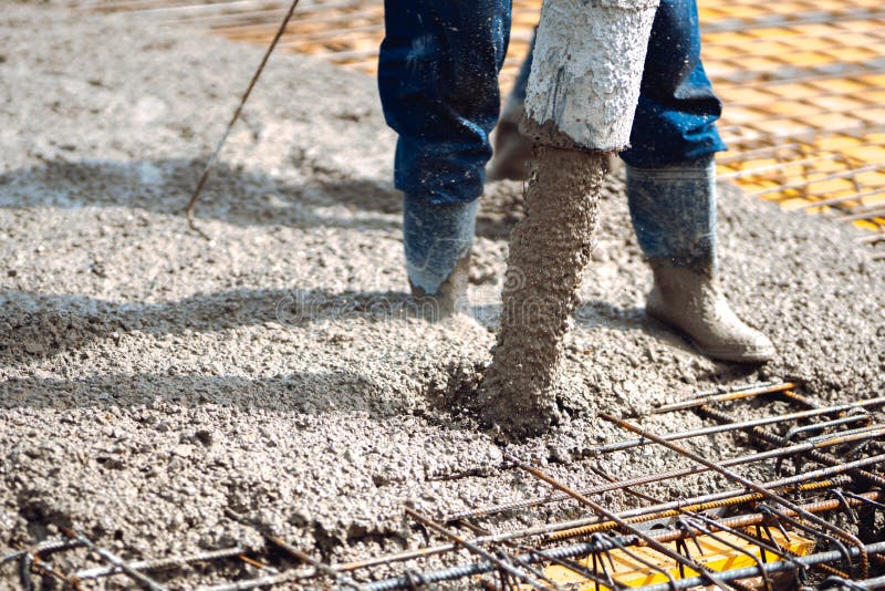 pouring cement and concrete into slabs layers of new house. Construction site details