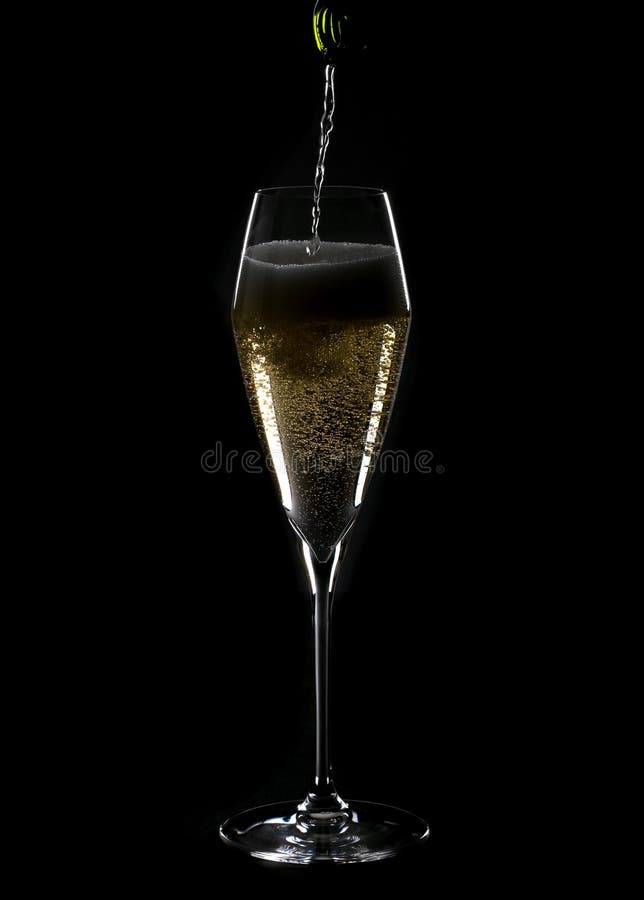 Pouring Champagne into a Lead Crystal Flute Back Lit 1