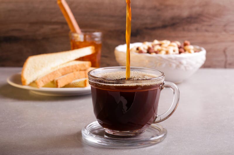 Pouring coffee in a glass stock photo. Image of rustic 78464162