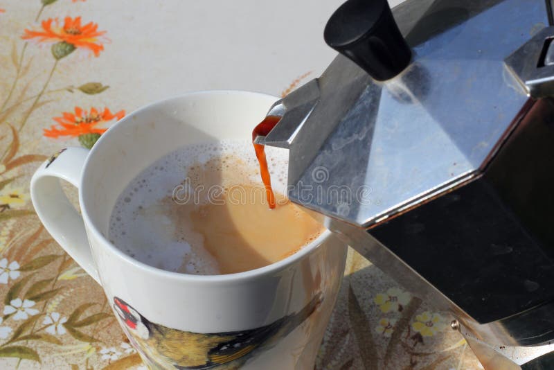 Pouring fresh coffee. royalty free stock image