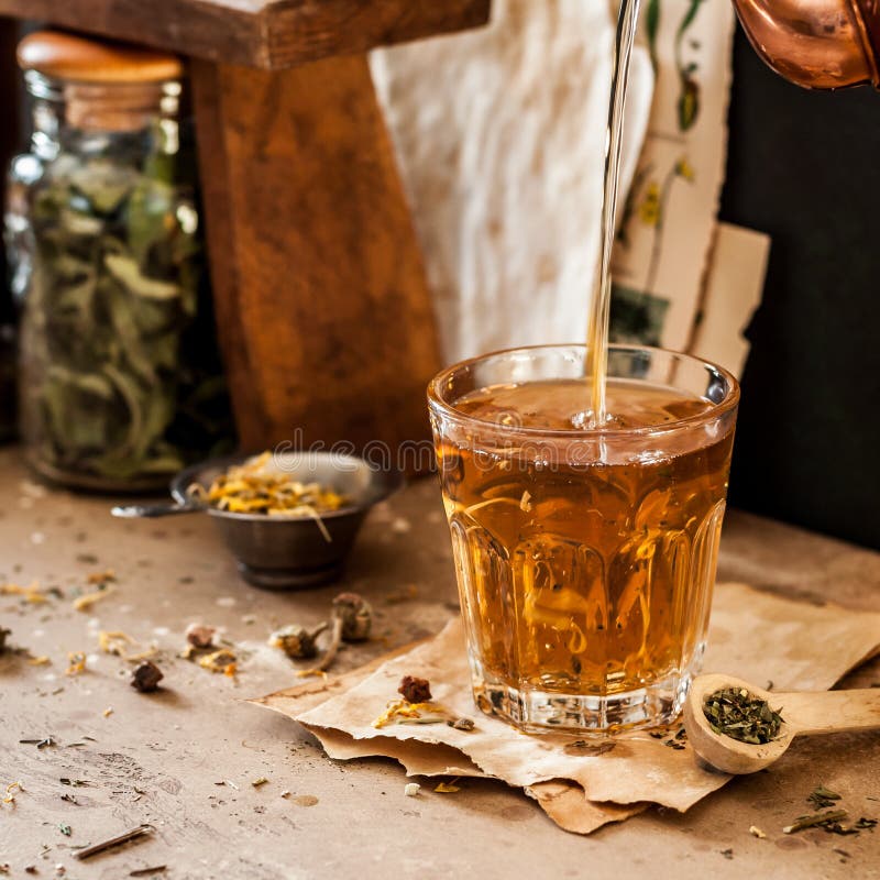 Pouring Herbal Tea Into Glass Cup Stock Photo - Image of health, brown ...