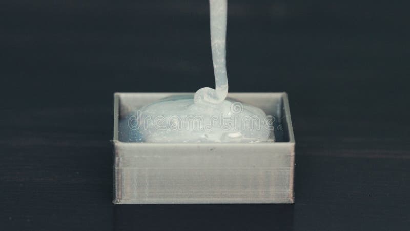 Pouring Liquid Silicone into 3D Printed Molds: Craftsmanship Close-up, Top View