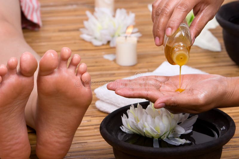 Pouring massage oil stock photo. Image of relaxation, hand 5609388