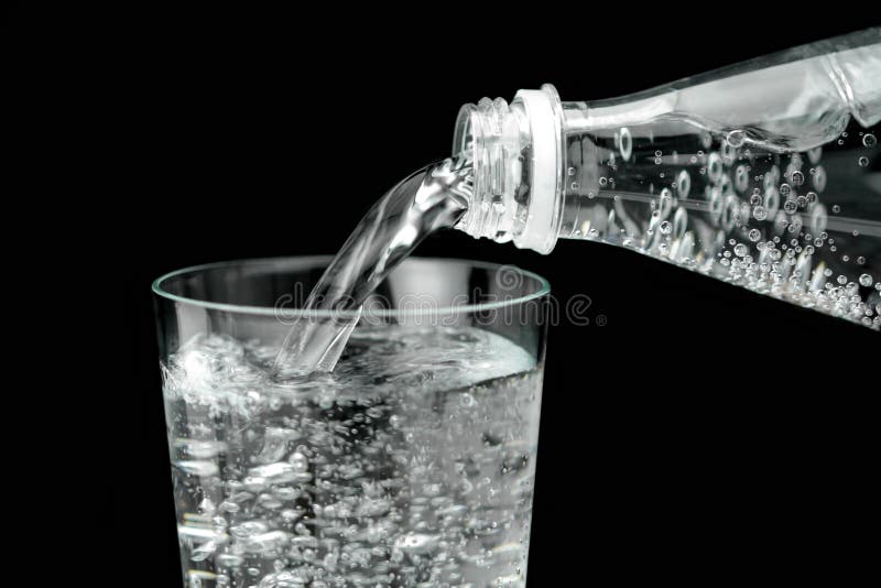 Pouring mineral water in the glass