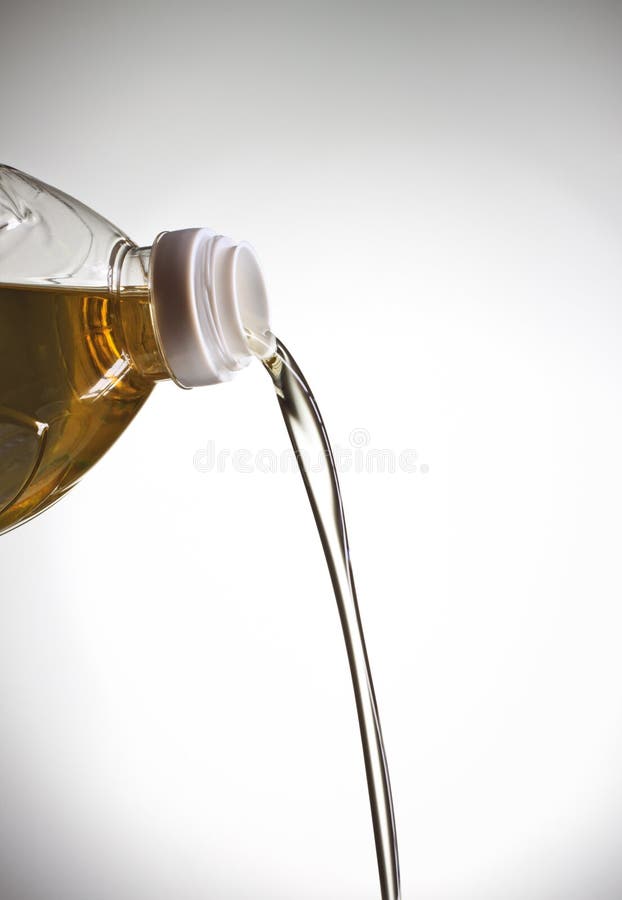 Pouring vegetable oil - Stock Image - C043/8956 - Science Photo
