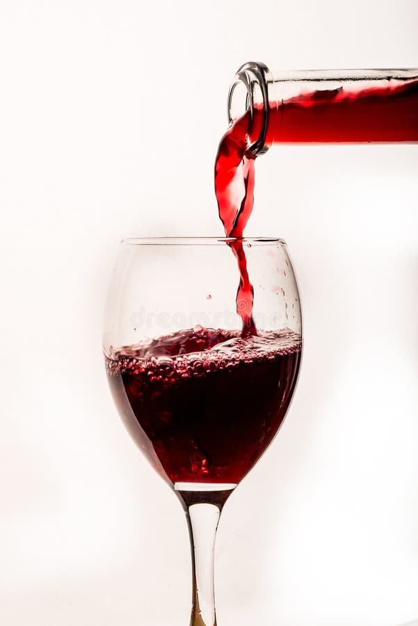 Pouring red wine into glass