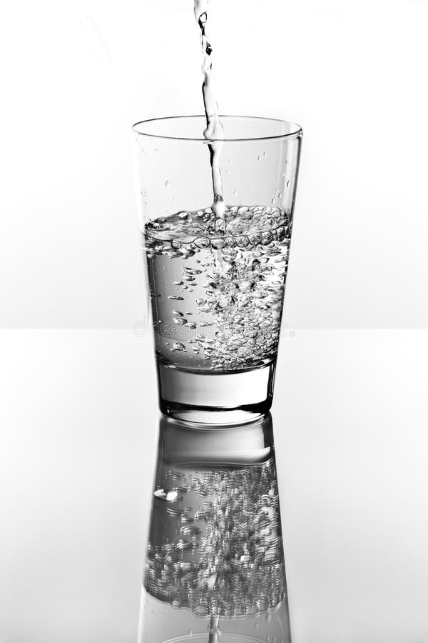 Water pouring into a glass stock image. Image of studio 24560467
