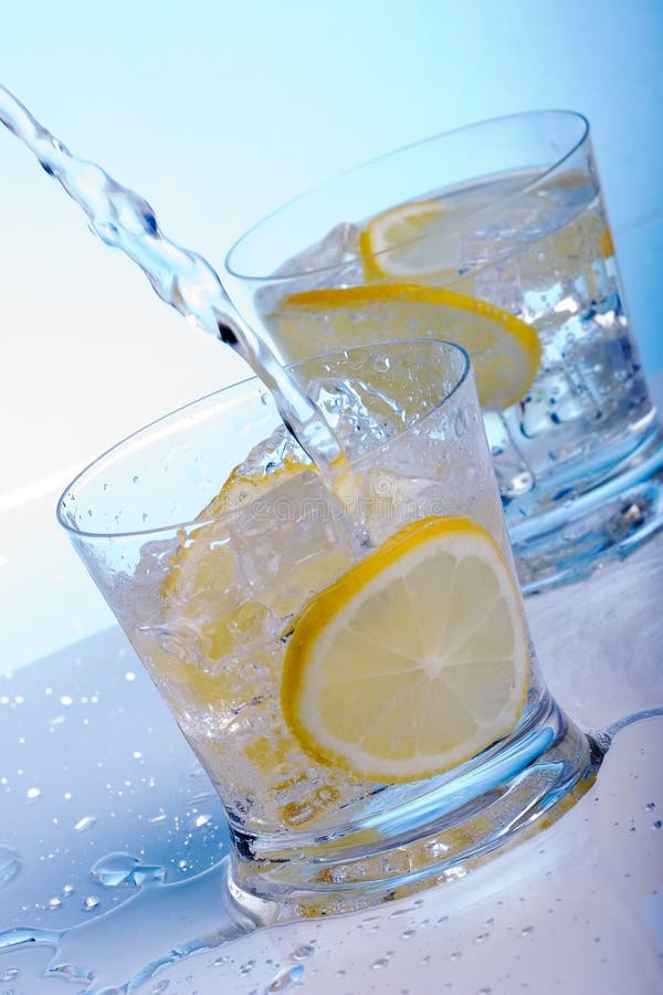 Pouring water into cocktails royalty free stock photo