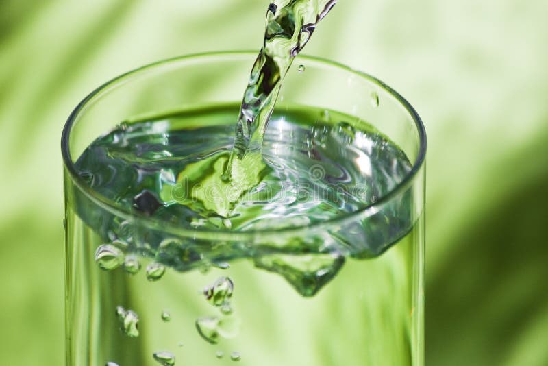 Pouring water in glass