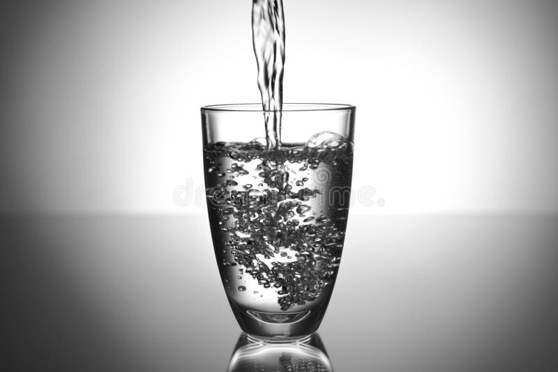 Pouring of Water in Glass on Table Stock Photo Image of light