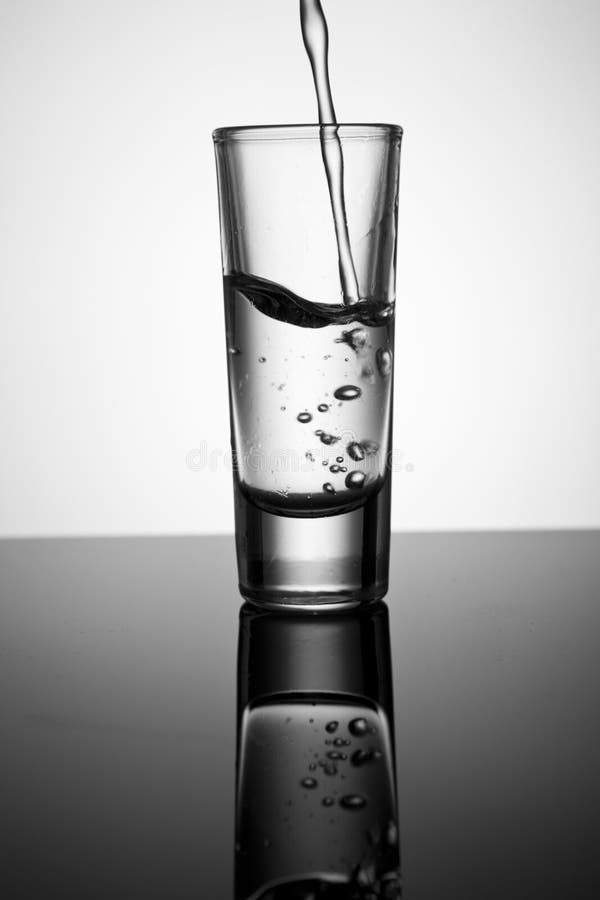 Pouring water on a glass stock image. Image of vitality 228682503