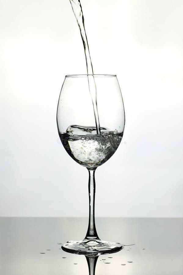 Pouring Water into Wine Glass Stock Photo Image of hold, motion 96828152