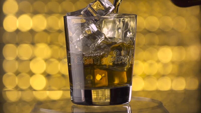 Pouring whiskey into glass