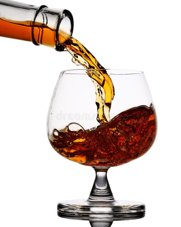 Pouring whiskey in glass stock image. Image of celebration 55630465