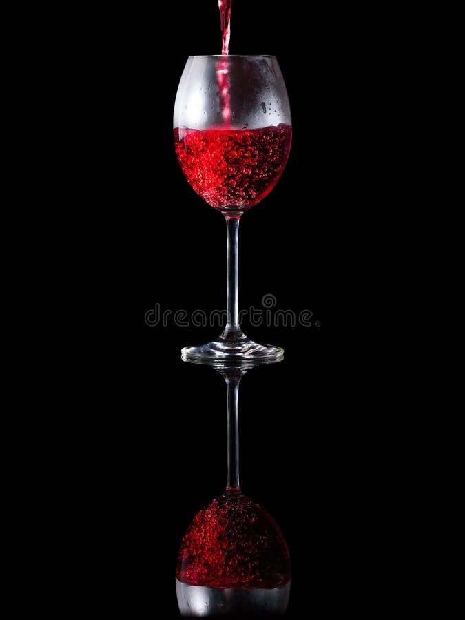 Pouring wine into an elegant glass stock image
