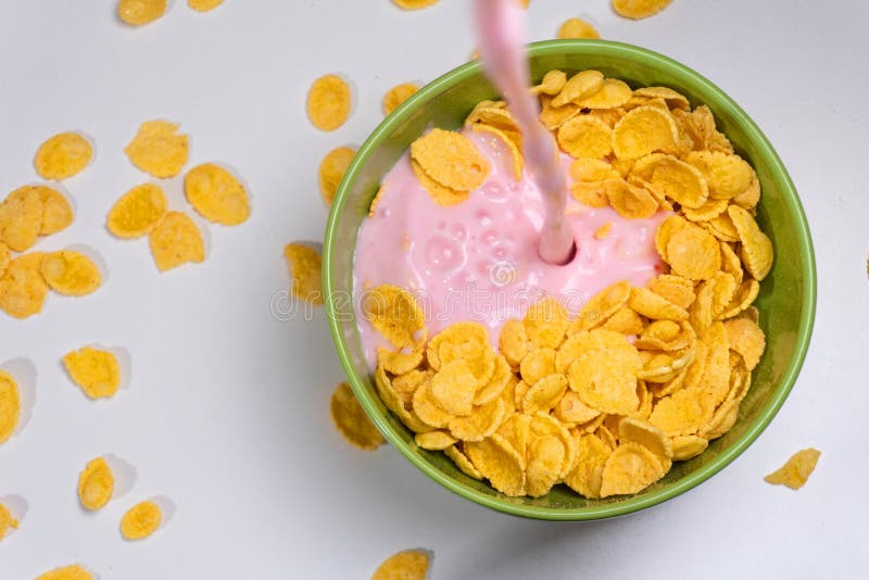 Pouring Yogurt from Top View on the Corn Flakes Stock Photo Image of