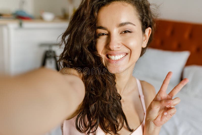 Pov Of Happy Caucasian Young Brunette Woman Posing To Smartphone Camera