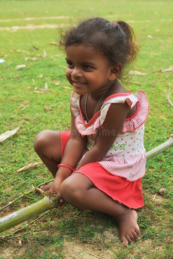 Poverty, portrait of a poor little African girl lost in deep thoughts royalty free stock photography