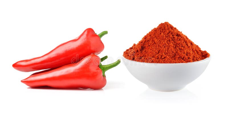 Powdered dried red pepper and red chili peppers in a white bowl stock photography Powdered dried red pepper and red chili peppers in a white bowl stock photography