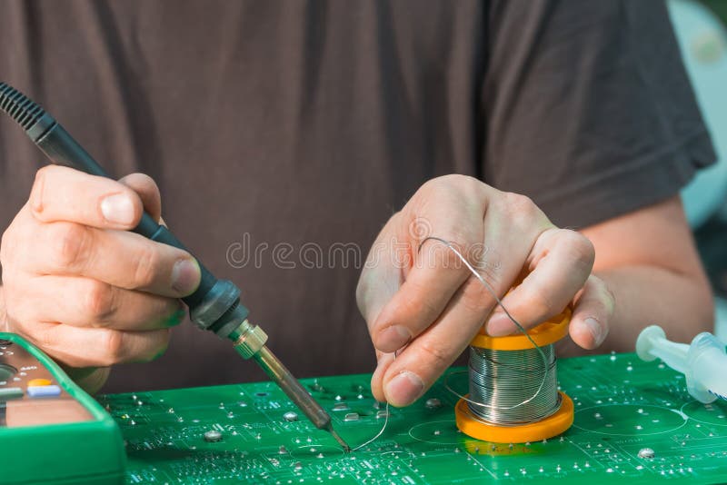 Power Board Repair with Soldering Iron and Solder Stock Photo Image