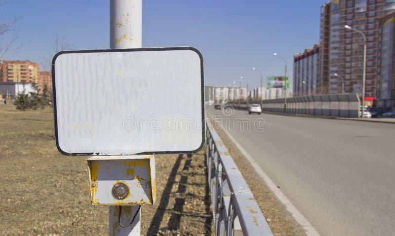 The power button traffic lights at the crosswalk with a blank sign. On an empty sign can be applied to the inscription of any stock photography The power button traffic lights at the crosswalk with a blank sign. On an empty sign can be applied to the inscription of any stock photography