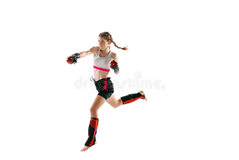 One sportive teen-girl, professional MMA fighter in action, motion isolated on white background. Concept of sport