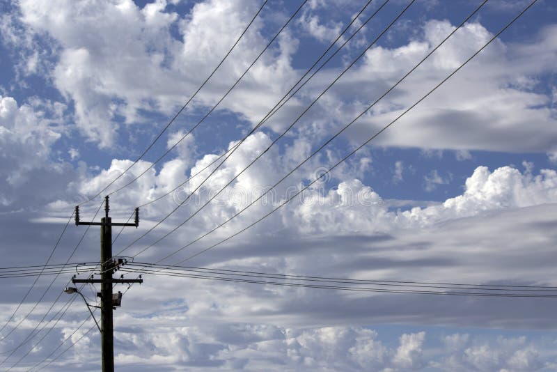 Power lines in Cloudy Urban Skyscape