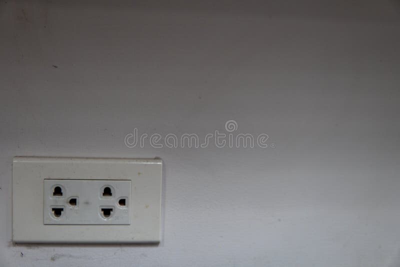 Power outlets with Spider`s wavy on a dirty white wall at one corner of the room stock image Power outlets with Spider`s wavy on a dirty white wall at one corner of the room stock image