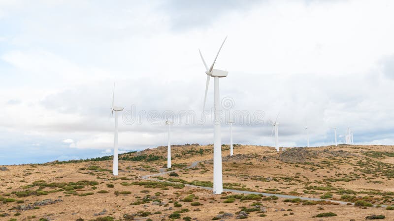 Power plant with wind turbines in open field background stock image