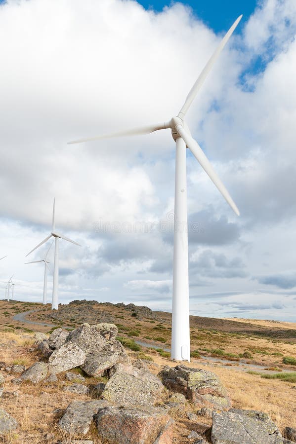 Power plant with wind turbines in open field background royalty free stock images