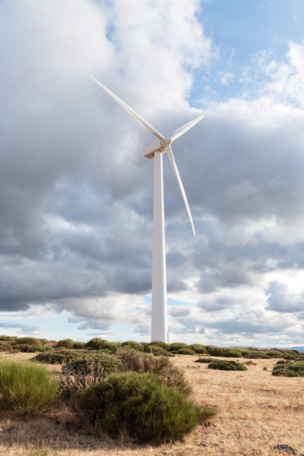 Power plant with wind turbines in open field background stock photography