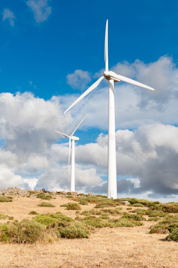 Power plant with wind turbines in open field background royalty free stock images