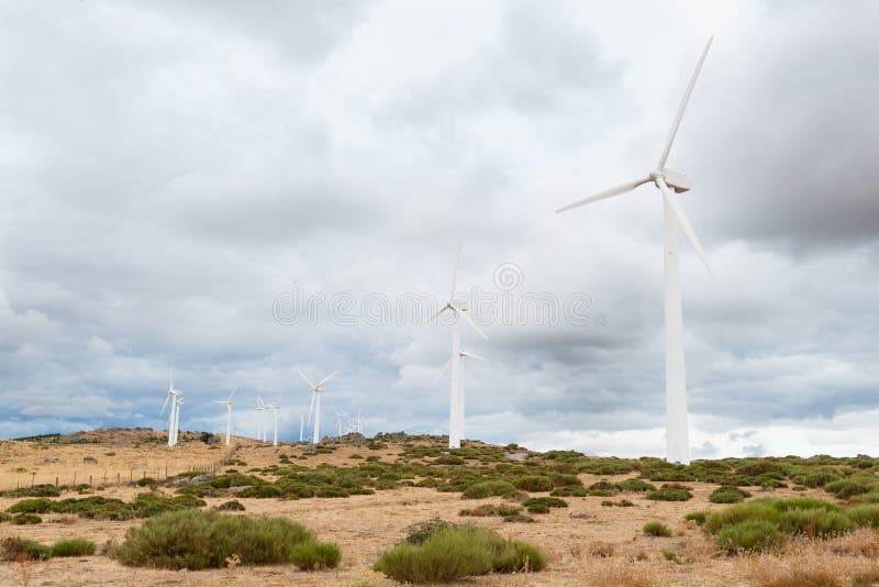 Power plant with wind turbines in open field background stock photography
