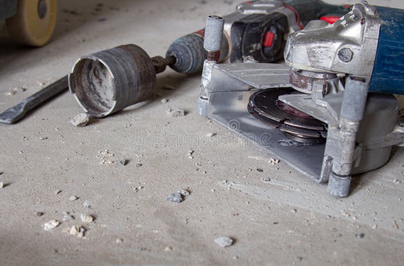 A Power Tool for Cutting Concrete Surfaces Lies Chaotically on the Floor Stock Image Image of