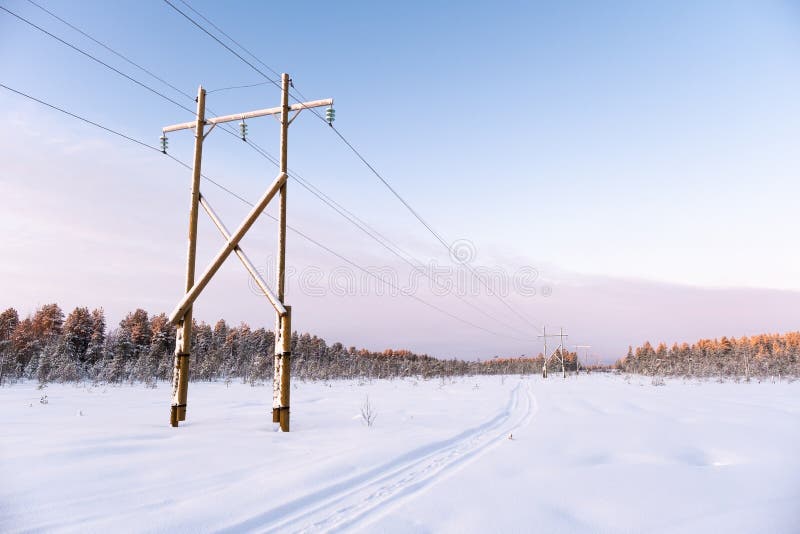 Power transmission line in winter snowy day. Electricity transportation royalty free stock images Power transmission line in winter snowy day. Electricity transportation royalty free stock images