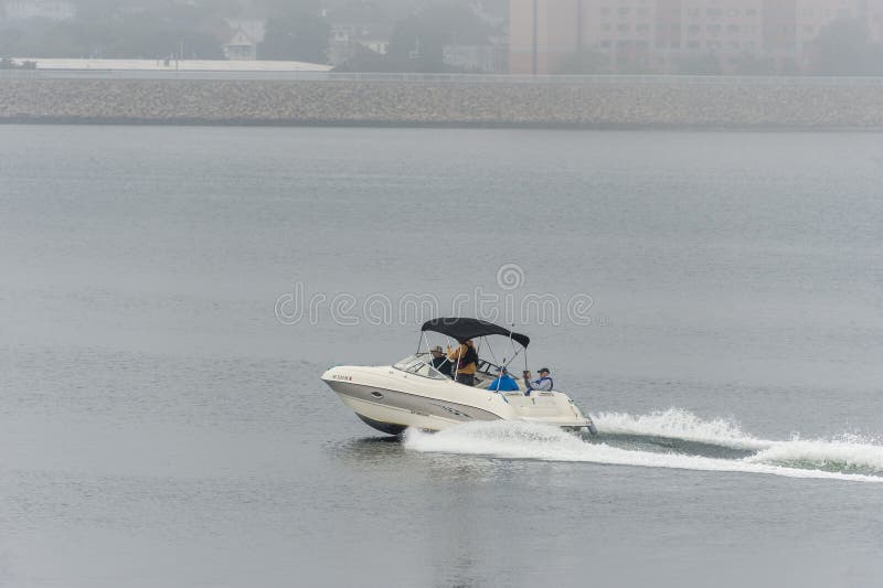 powerboat is underway in fog