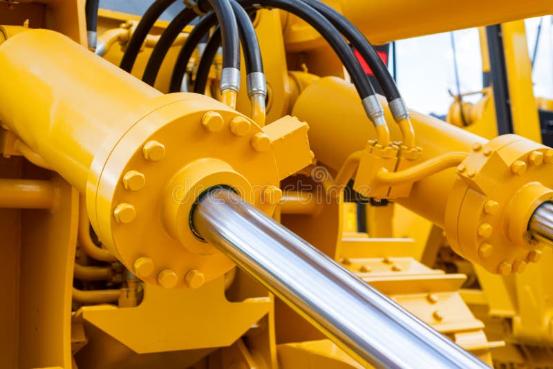 Powerful hydraulic cylinders. The main power and driving element for construction equipment stock photos